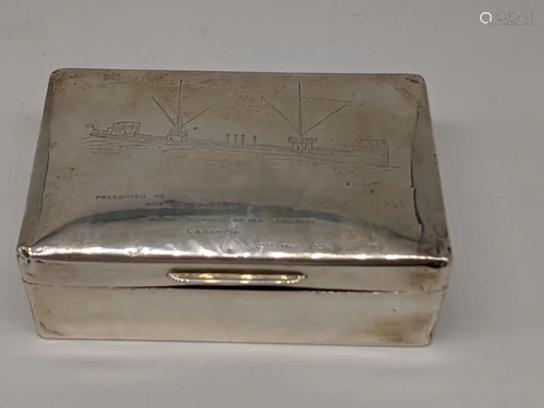 An early 20th century silver cigar, depicting a ship