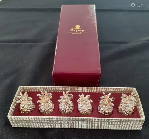 A set of six gilt metal pineapple place holders, with