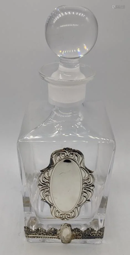 An Israeli glass decanter with silver banding and a