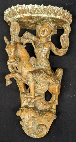 An early East Asian wall carving of a horseback rider,