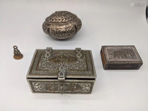 An Islamic silver box inlaid with copper scripture,