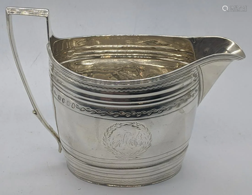 A George III silver cream jug, hallmarked London,