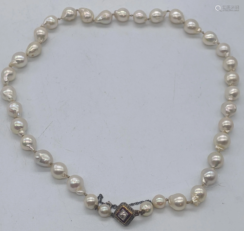 A pearl and diamond choker, single string of freshwater