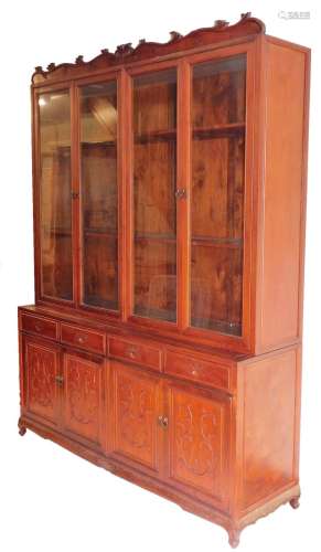 A Chinese hardwood breakfront display cabinet, the top with ...