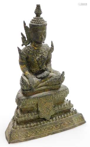 A Thai bronze figure of a seated Buddha, on a Tiered base, 1...