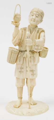 A Japanese sectional ivory okimono of a man, holding aloft a...