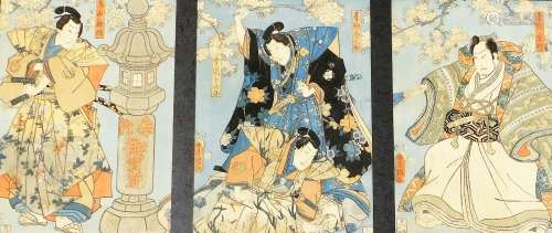 A framed Japanese woodblock triptych by Utagawa Kunisada, a ...