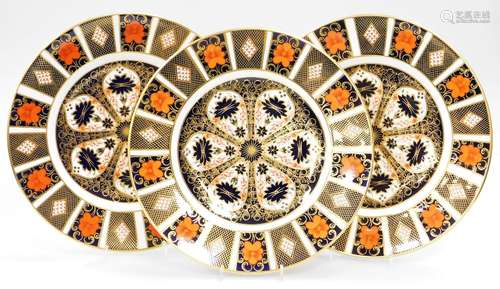 Three Royal Crown Derby 1128 pattern Imari plates, 27cm wide...