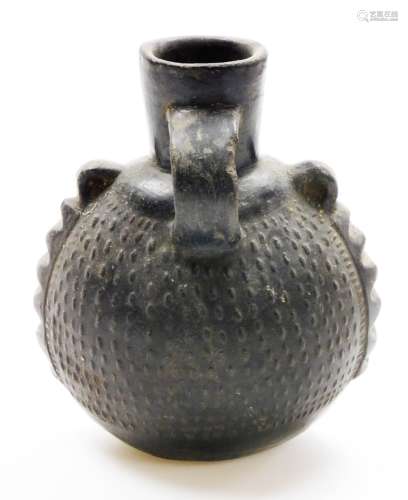 A Chinese pottery ovoid ewer with single handle and relief d...