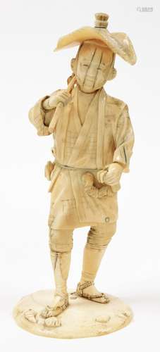 A Japanese sectional ivory okimono of a farmer in straw hat ...