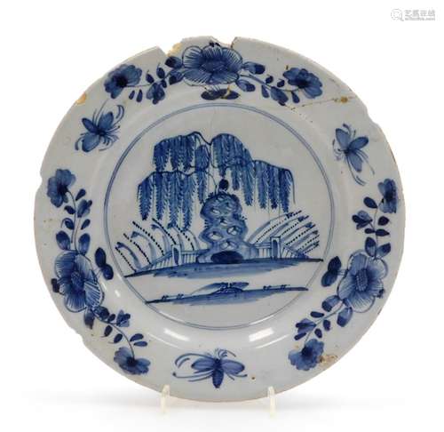 A mid-18thC English porcelain charger, depicting bridges and...