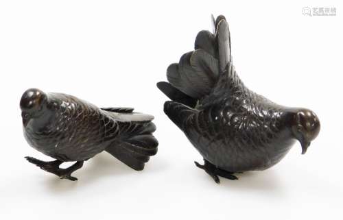 A pair of small Japanese bronze figures of doves, Meiji/Tais...