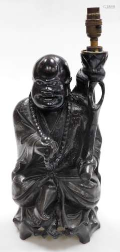A Chinese teak figure of seated Putai with beads and staff, ...