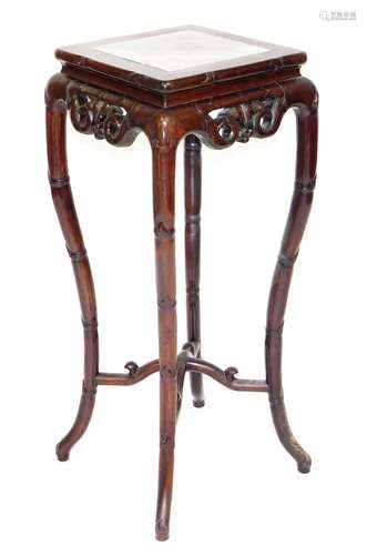 A late 19thC Chinese hardwood plant stand, the square top wi...