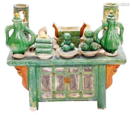 A Chinese Tang style sancai pottery model of a cabinet, fest...
