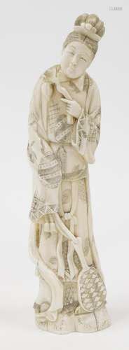 A Japanese marine ivory okimono of a woman, in flowing robes...