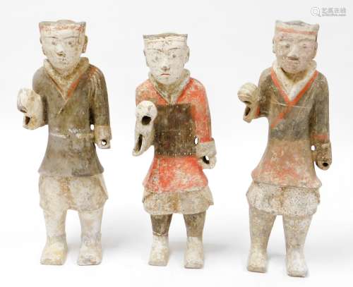A set of three Western Tang Dynasty painted pottery figures ...