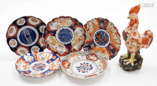A Japanese Imari plate, decorated in enamels with floral rou...