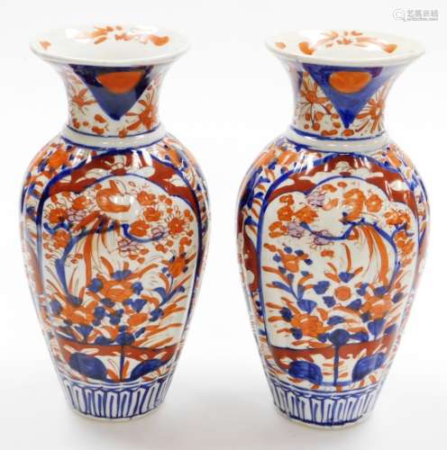 A pair of Japanese Imari baluster vases, decorated with pane...