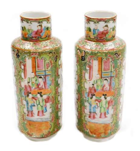 A pair of Chinese Canton vases, each with panels of figures,...