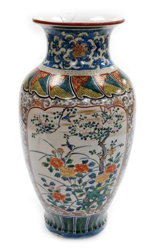 A large Japanese Kutani baluster vase, the panels of birds a...