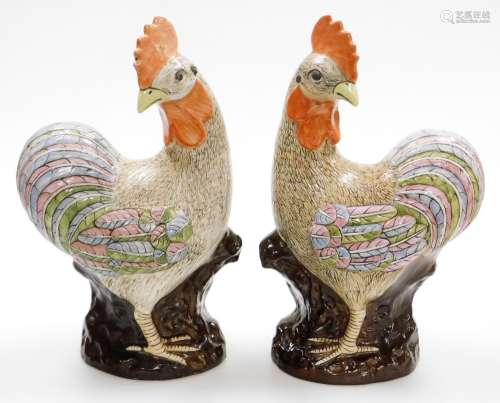 A pair of late 20thC Chinese pottery figure of cockerels, wi...