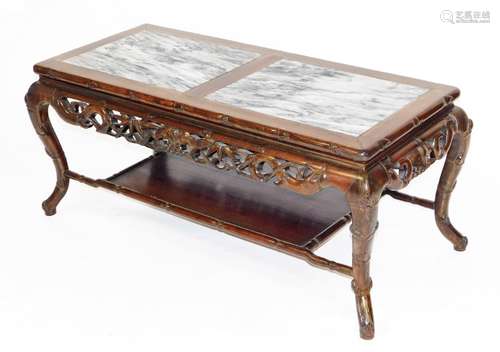 A Chinese rosewood coffee table, carved in imitation of bamb...