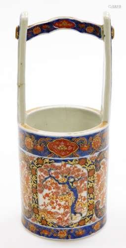A 19thC Japanese Imari porcelain vase shaped as a well bucke...