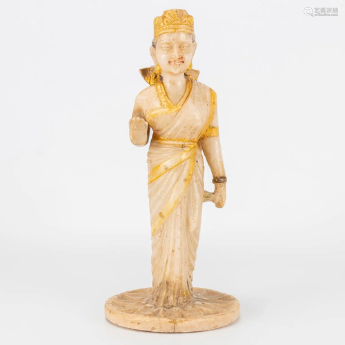 An Indian statue made of alabaster and standing on a