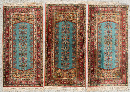 A set of 3 identical, Oriental carpets.