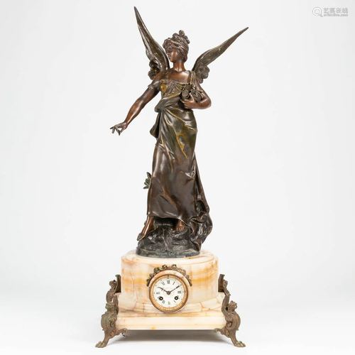 A clock made of alabaster, mounted with spelter angel