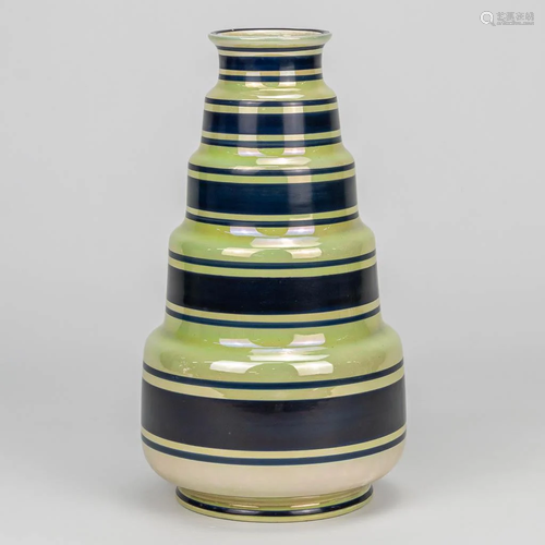 A ceramic vase made with luster glaze and marked