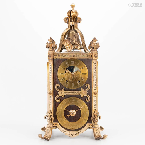 A clock made of metal and marked 'Je sonne la bonne