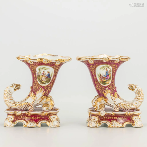 A pair of horn vases, decorated with eagles and