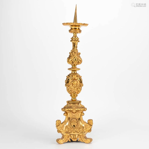 A candlestick in neogothic style, made of gilt bronze.