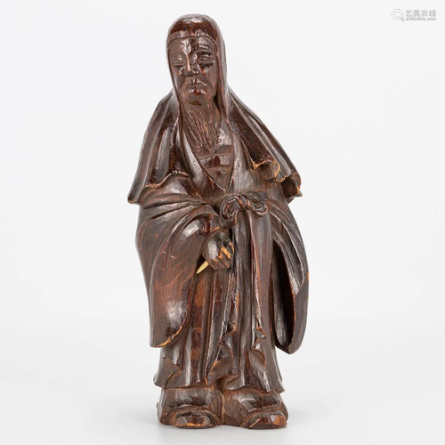 A wood sculpture of an Oriental man, first half of the