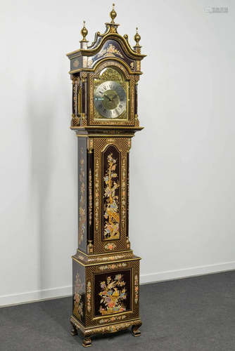 A standing clock with hand-painted decor, made in