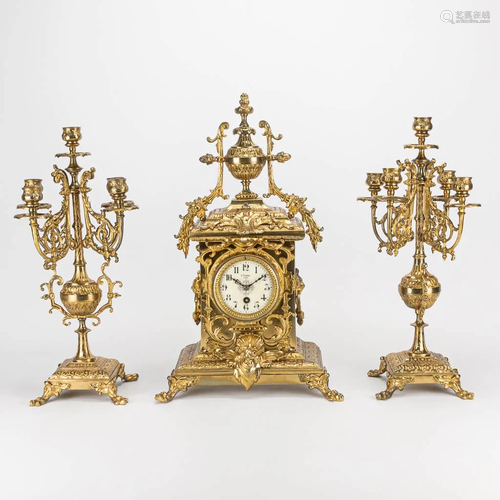 A three piece garniture clock made of bronze. The first