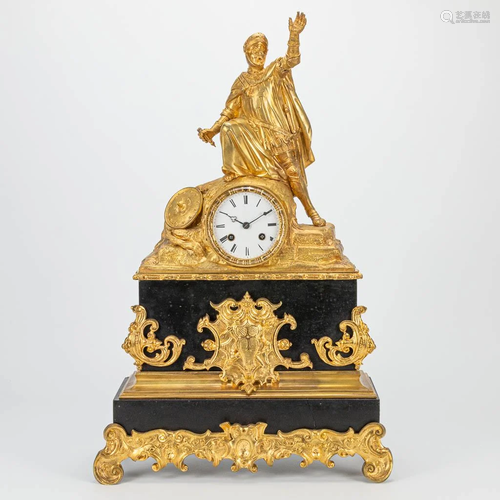 A mantle clock made of gilt bronze and marble with a