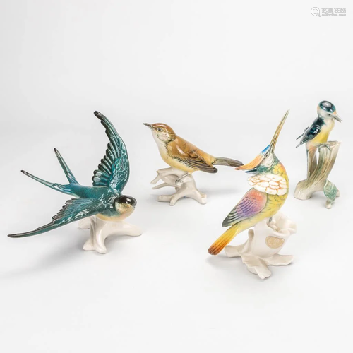 A collection of 4 porcelain birds made in Germany.