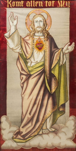 An embroidery of Jesus Christ with 'Sacred Heart' and