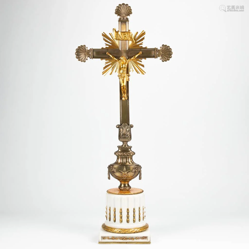 An imposing crucifix standing on a marble base.