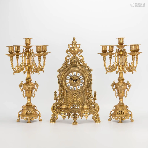 A 3 piece garniture clockset made of bronze, consisting