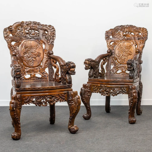 A pair of Chinese armchairs made of sculptured hardwood