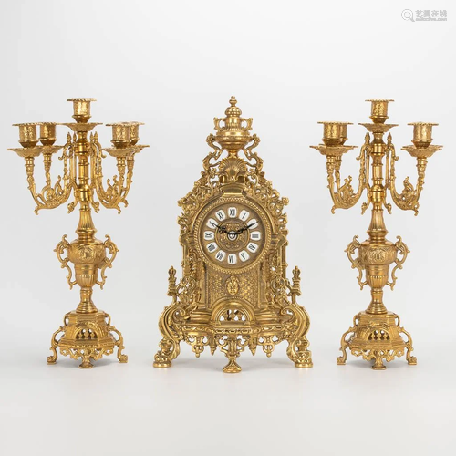 A 3 piece garniture clockset made of bronze, consisting