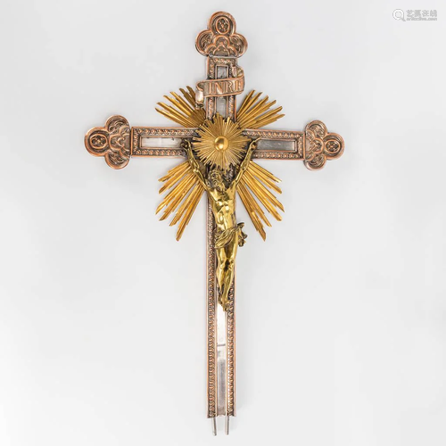 An antique crucifix made of silver-plated copper and