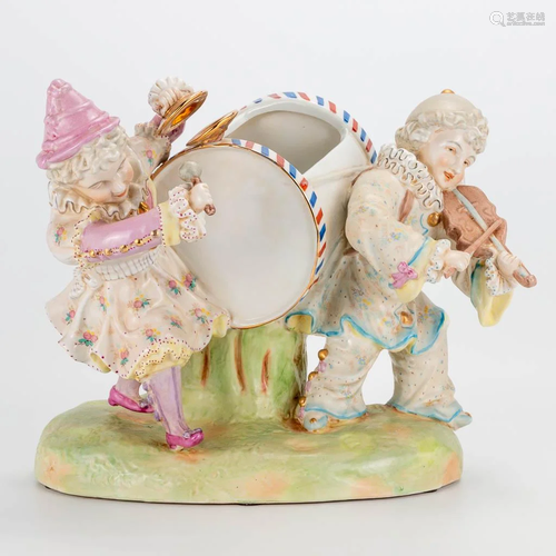 A porcelain group of two musical clowns, marked R.B.