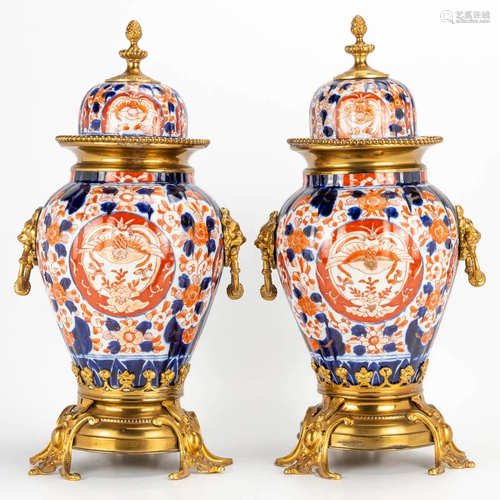 a pair of bronze mounted Japanse Imari vases, made