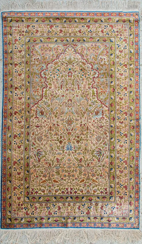 An Oriental hand-made carpet made of silk and marked