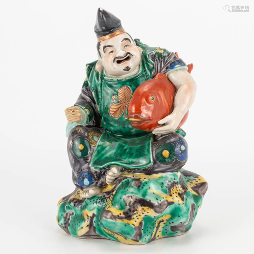 A Chinese porcelain statue of a fisherman. 19th/20th